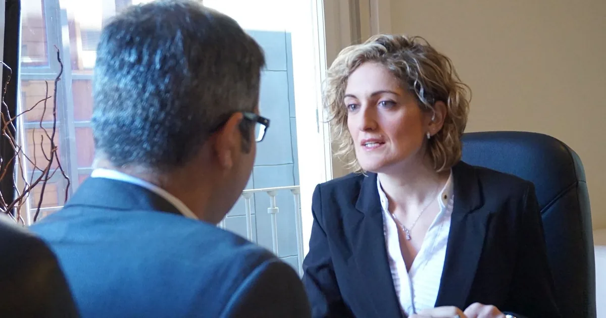 An employer discussing recruitment terms with an agency consultant